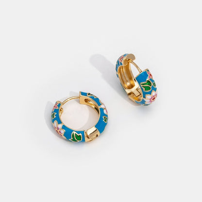 Sara | Arojes de oreja en forma de círculo dorado con flor